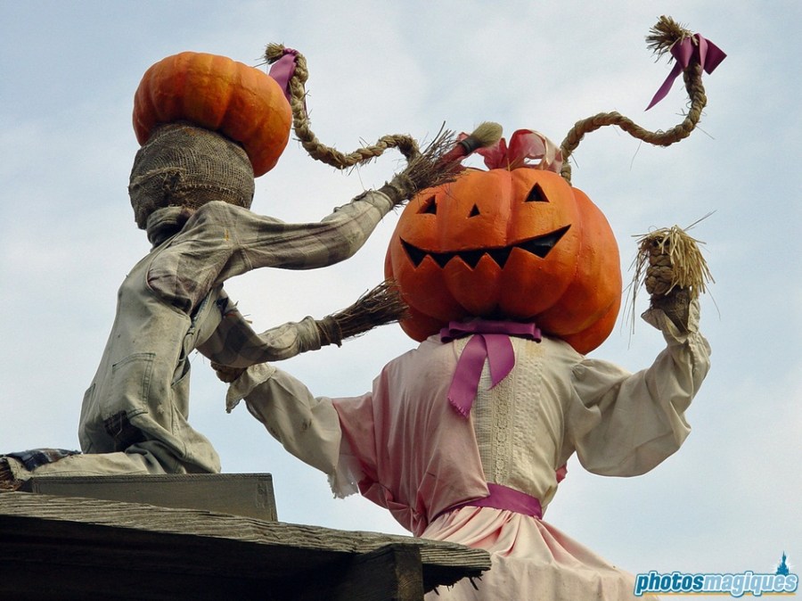 The friendly scarecrows nurture the patch